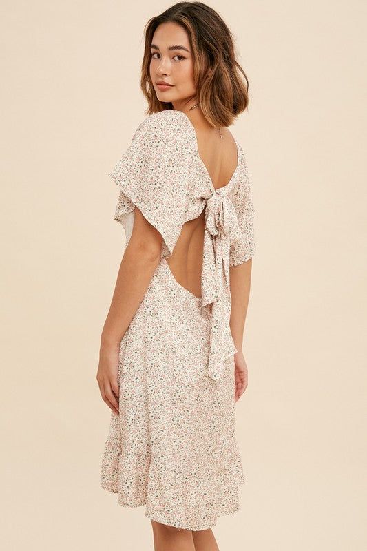 This FLORAL BOW BACK MINI DRESS exudes sophistication with its full lining and back cut out. Featuring a back invisible zipper, this dress is crafted from 100% rayon for a lightweight and comfortable feel. Perfect for any special occasion or night out. True to size Lined Open back Fitted Dress With Back Opening For Spring, Fitted Spring Dress With Back Opening, Summer Backless Mini Dress With Back Zipper, Fitted Backless Dress With Tie Back For Casual Occasions, Fitted Backless Dress For Dress Down, Fitted Maxi Dress With Back Opening For Spring, Fitted Backless Dress With Tie Back For Casual Wear, Fitted Backless Dress For Casual Occasions, Spring Backless Dress With Back Opening