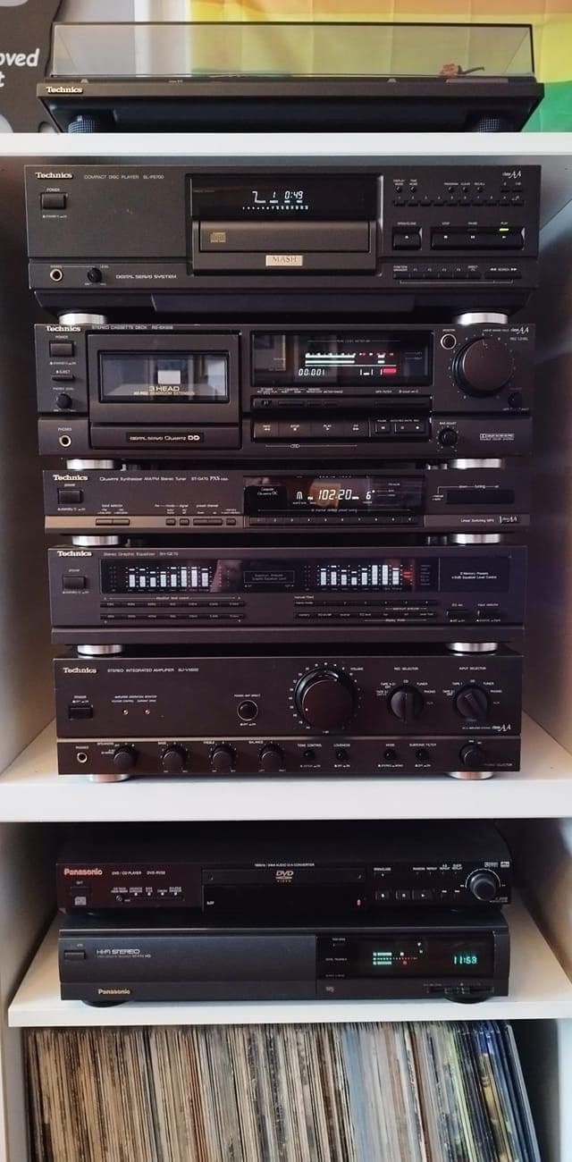 there are many different types of stereos on the shelves in front of each other