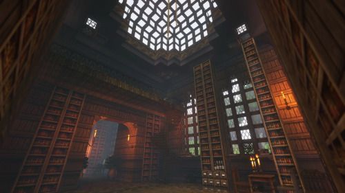 the interior of a library with lots of bookshelves