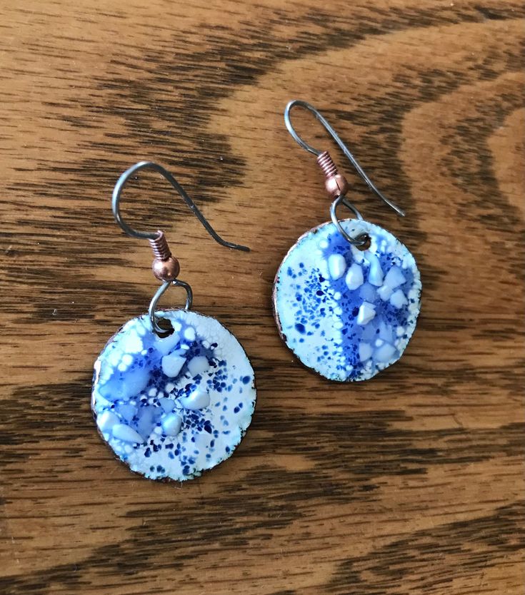 Blue and White Copper Earrings These beautiful blue and White earrings will go with many different outfits. They have hypoallergenic stainless steel French hook ear wires, with rubber backs. The earrings have been torched fired by hand, with many layers and firings. Enameling is an ancient process that fuses powdered glass (enamel) onto pieces of metal. This creates a glassy, glossy finish. These blue enameled dangle earrings were handmade in my studio in Eastern Washington. I have been making j Nickel-free Blue Circular Earrings, Blue Nickel-free Round Earrings, Nickel-free Blue Earrings, Hypoallergenic Blue Circular Jewelry, Blue Enamel Hypoallergenic Jewelry, Blue Hypoallergenic Enamel Jewelry, Hypoallergenic Blue Enamel Jewelry, Blue Metal Jewelry, Blue Metal Earrings For Everyday Wear