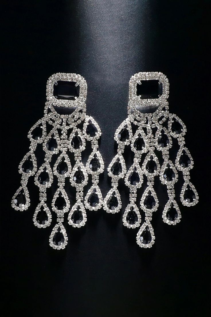 Elevate your style with our Diamond Floral Fringe Earrings. These stunning earrings showcase intricate diamond-encrusted floral designs with delicate fringe details. The combination of diamonds and cascading fringes adds a touch of sophistication and movement, making them a perfect accessory for special occasions. Embrace a look that effortlessly blends luxury and trendiness with these captivating earrings. Crystal Chandelier Earrings With Rhinestone Fringe, Silver Tassel Earrings With Rhinestone Fringe, Dangle Crystal Earrings With Rhinestone Fringe, Silver Crystal Dangle Tassel Earrings, Glamorous Rhinestone Tassel Earrings, Glamorous Crystal Dangle Tassel Earrings, Crystal Tassel Earrings With Rhinestone Fringe, Glamorous Tassel Earrings For Wedding, Glamorous Crystal Tassel Earrings With Rhinestone Fringe