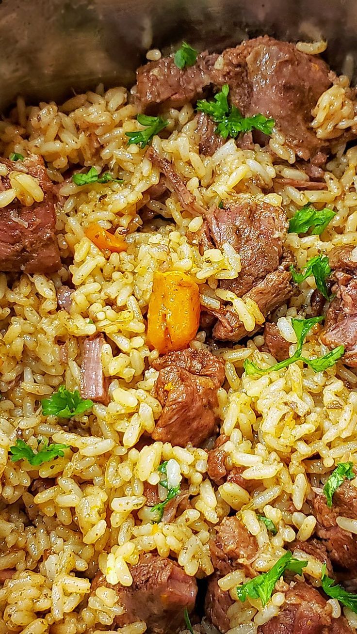 rice with meat and vegetables in a pan