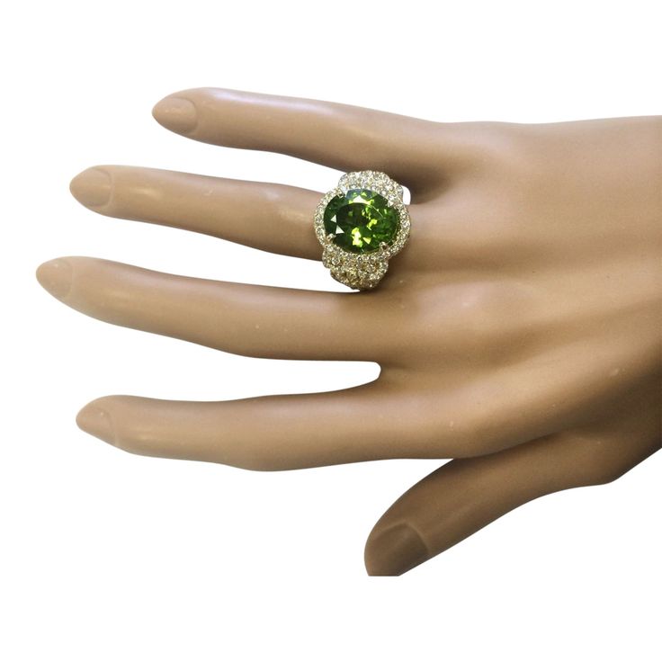 Stamped: 14K Yellow GoldTotal Ring Weight: 10.0 GramsRing Length: N/ARing Width: N/AGemstone Weight: Total Natural Peridot Weight is 6.52 Carat (Measures: 12.90x11.30 mm)Color: GreenDiamond Weight: Total Natural Diamond Weight is 1.50 Ca... Luxury Peridot Ring For Formal Occasions, Luxury Multi-stone Peridot Ring, Luxury Peridot Multi-stone Rings, Luxury Peridot Rings With Accent Stones, Oval Peridot Diamond Ring For Formal Occasions, Formal Peridot Diamond Ring With Prong Setting, Formal Oval Peridot Diamond Ring, Formal Peridot Diamond Ring With Center Stone, Luxury Oval Peridot Rings