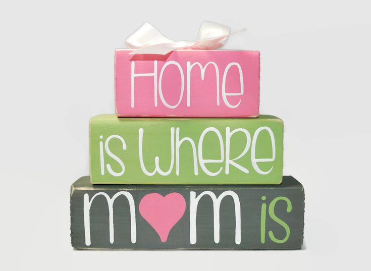 three wooden blocks with the words home is where mom is written on them and a pink heart