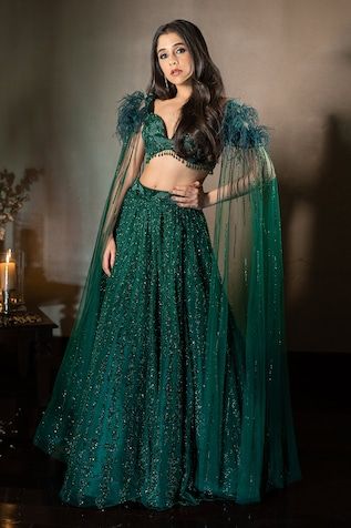 Emerald green attached can-can lehenga with geometric pattern sequin and cutdana embroidery. Paired with cape draped sleeve with feather detailing padded blouse. - Aza Fashions Green Indian Outfit, Emerald Green Lehenga, Lehenga Green, Dress Stitching, Bridesmaid Photoshoot, Lehenga Pattern, Sangeet Outfit, Indian Outfits Lehenga, Lehenga Designs Simple