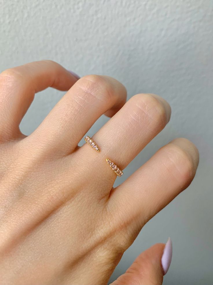 This gorgeous, timeless Morganite open band comes in your choice of sterling silver, 14k Rose Gold Vermeil or 14k Gold Vermeil.  Sold separately.   If you want a top and bottom, you will need to buy 2.  Gemstone engagement ring sold separately.  This listing is for the curved band only.   ✦ DETAILS ✦ ✧ Handcrafted  ✧ Sizes 3.75-11.25 ✧ Curved band only - Gemstone engagement ring sold separately ✧ This piece will arrive ready to gift in a Kherish Jewelry Pouch. ✧ Due to the nature of the handmade process, each piece may slightly vary in color, size, shape, and contain natural inclusions. Every piece is gorgeous and one of a kind.  *Please refer to photos for reference.  ✦ This Artist Has Autism✦  Every item you order from Kherish is  handcrafted and packed by an artist with autism in RVA. T Minimalist Open Ring With Diamond Accents, Minimalist Open Band Jewelry With Prong Setting, Dainty Diamond Ring With Open Band, Minimalist Cubic Zirconia Open Ring For Wedding, 14k White Gold Open Band Midi Rings, Minimalist Cubic Zirconia Open Band Diamond Ring, Stackable Open Initial Ring In Rose Gold, Delicate White Gold Open Diamond Ring, Stackable Rose Gold Initial Ring Open Design