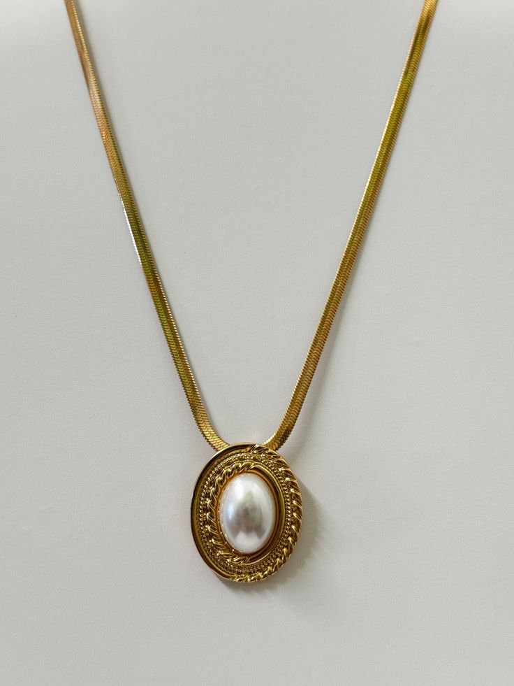 18k Vintage Gold Plating Faux Pearl Pendant Size: 1" x 1.25" Chain Length: 16" Extension Length: 2" Gold Metal Pendant Locket Necklace, Elegant Gold Locket Necklace, Classic Gold Pearl Chain Charm Necklaces, Classic Gold Charm Necklace With Pearl Chain, Gold Oval Pendant Chain Necklace, Tarnish Resistant, Oval Gold Plated Necklaces, Gold Plated Oval Necklace, Gold Chain Necklace With Tarnish Resistant Oval Pendant, Gold Chain Necklace With Oval Pendant, Tarnish Resistant