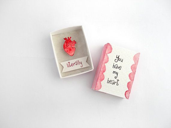 two valentine's day cards in a box with a heart on the front and an i love you note on the back