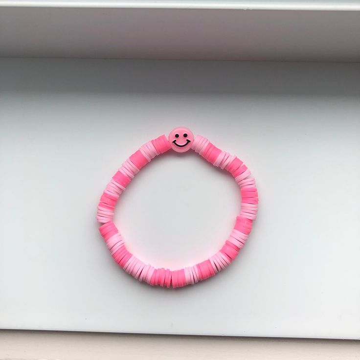 This beautiful preppy bracelet is an amazing gift. It's two shades of pink and there is a pink smiley face in the middle. You can put it on you wrist easily by rolling it. Pink Smiley Face, Pink Smiley, Preppy Bracelets, Summer Bracelet, Summer Bracelets, Bracelet Ideas, Pink Summer, Shades Of Pink, Clay Beads