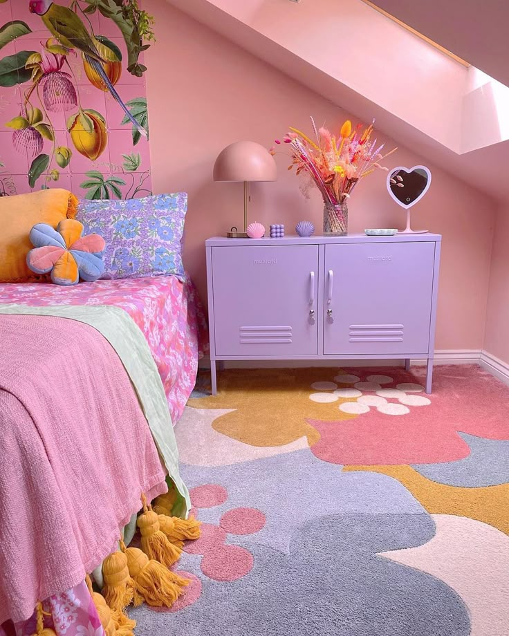 a bedroom with pink and yellow decor in the corner, on top of a carpeted floor