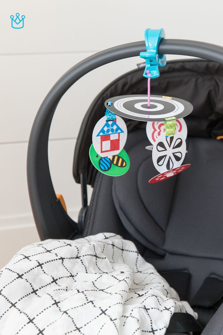 an infant car seat with some magnets on it