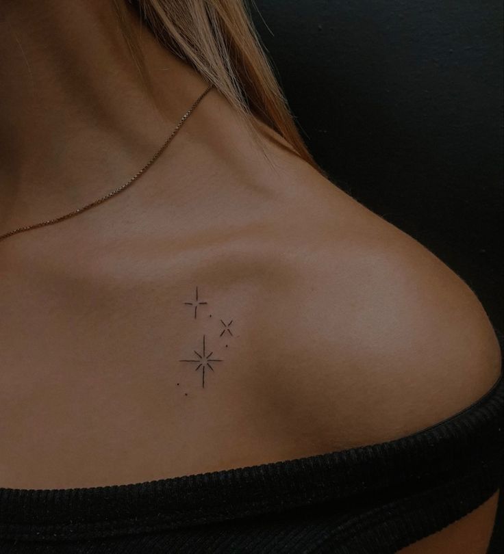 a woman with a cross tattoo on her chest