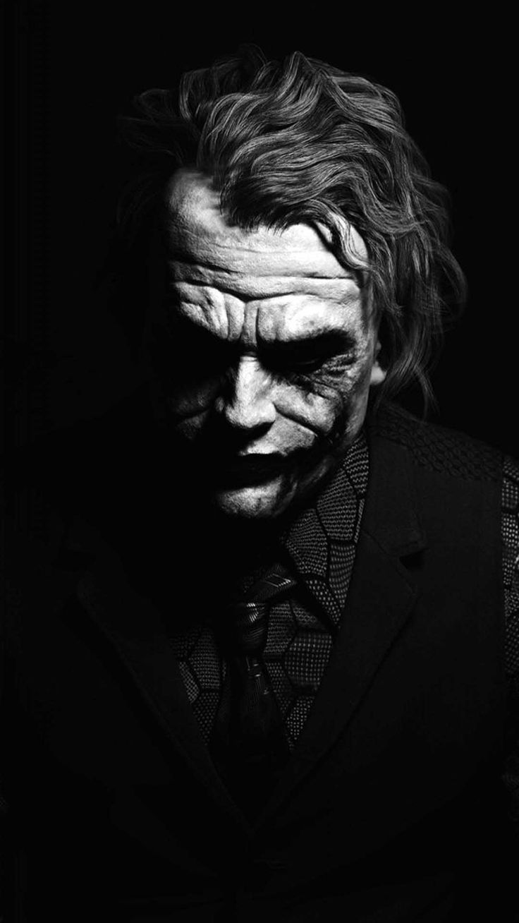 the joker in black and white with his face painted like it's from the dark knight