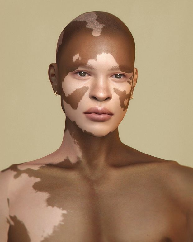 a woman with white paint on her face and chest