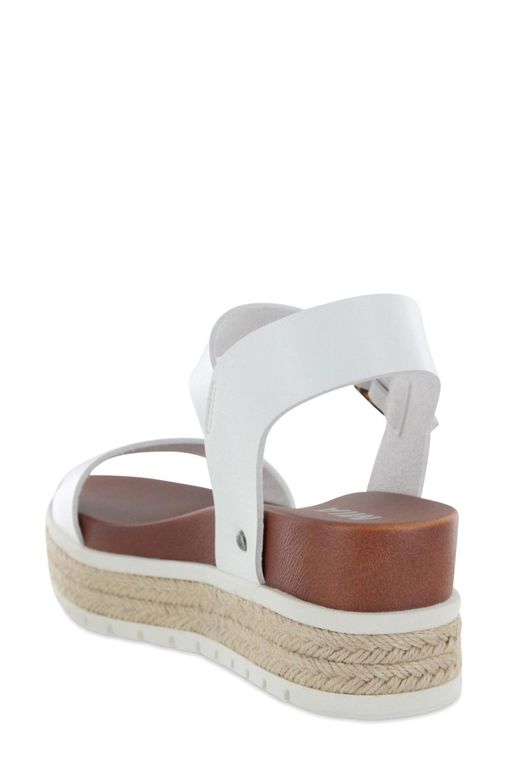 An anatomically contoured footbed brings comfort to every step in this stylish espadrille-inspired sandal elevated with a wedge and jute-wrapped platform. 1 1/4" heel Adjustable strap with buckle closure Cushioned footbed Synthetic upper, lining and sole Imported Vacation Espadrille Wedge Sandals With Textured Sole, Vacation Wedge Sandals With Textured Sole, Casual Beach Wedge Heel Sport Sandals, Beach Ankle Strap Footbed Sandals With Arch Support, Casual Beach Sport Sandals With Wedge Heel, Ankle Strap Footbed Sandals With Arch Support For Beach, Beach Footbed Sandals With Arch Support And Ankle Strap, Comfortable Sandals With Textured Footbed And Wedge Heel, Adjustable Platform Footbed Sandals Casual