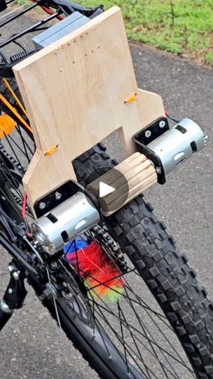 a bicycle with a wooden box attached to the front wheel