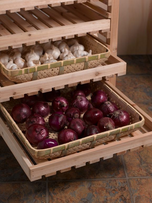 two wooden crates filled with onions and mushrooms