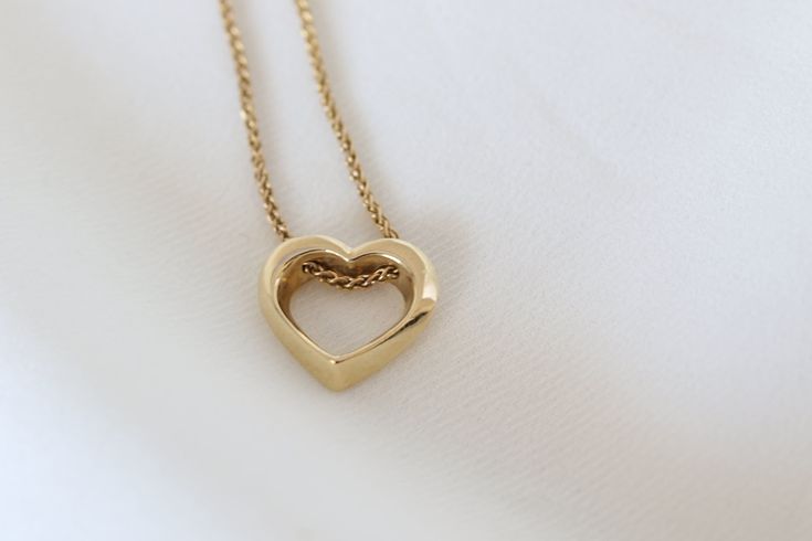 14K solid gold heart pendant minimalist love necklace. geometric 3D heart, valentines day gift.  A unique heart pendant design with a geometric structure paired with a wheat style gold chain which flows through the heart.  Pendant & Chain description: * Pendant height: 0.43'' - 11 mm. * Width: 0.49'' - 12.5 mm. * Materiel: 14K Gold. * Necklace length: 17.7'' - 45 cm. Variations: * White gold may be optional. Feel free to contact me for availability. *If you like the style but did not find just t Modern 14k Gold Heart Jewelry, Modern Gold Heart Cut Jewelry, Modern Yellow Gold Jewelry For Valentine's Day, Modern Heart Cut Jewelry For Gift, Modern Heart Cut Jewelry Gift, Minimalist 14k Gold Heart Necklace For Anniversary, Modern Yellow Gold Heart Pendant Necklace, Minimalist Heart Cut Necklace For Anniversary, Modern Open Heart Jewelry For Gifts