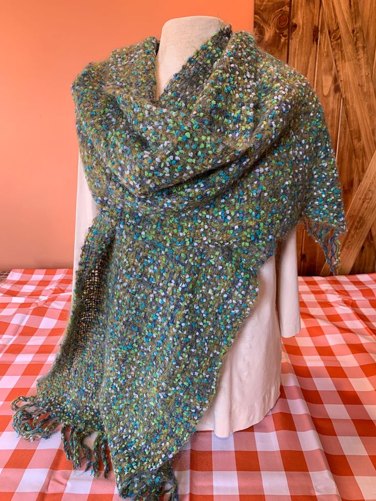 Colors of green and blues Length 81" Width 16.5" Green Shawl For Fall, Green Scarves For Winter, Green Bohemian Scarf For Fall, Green One-size Shawl For Fall, Festive Green Bohemian Scarves, Green Bohemian Shawl Wrap, Green Winter Scarves One Size, Green Bohemian Wrap Scarf, Green Bohemian Scarf Wrap