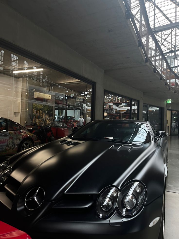 a black car parked in front of a building