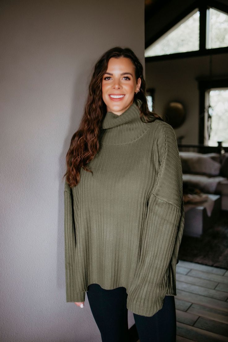 Stay stylish and cozy with the Bonnie Fold Over Sweater by Lily & Lottie. This oversized sweater features a fold-over neckline and long sleeves, perfect for any occasion. Made with soft knit material, it offers both comfort and on-trend style. Lauire: Wears a size XS-S. Brittany: Wears a size XS-S. Kara: Wears a size XS-S. Madison: Wears a size XS-S. Jen: Wears a size XS-S. Kaylee: Wears a size XL-2XL. Material: 100% Acrylic Measurements: Body Length: 25" | Sleeve Length: 17" XS-S: Bust: 64" | A Oversized Long Sleeve Turtleneck For Cold Weather, Solid Sweater For Fall Loungewear, Oversized Ribbed Knit Top For Fall, Oversized Long Sleeve Knit Top, Cozy Fall Turtleneck In Relaxed Fit, Cozy Fall Turtleneck With Relaxed Fit, Cold Weather Turtleneck With Ribbed Cuffs, Oversized Turtleneck For Cold Fall Weather, Long Sleeve Ribbed Top For Cold Weather