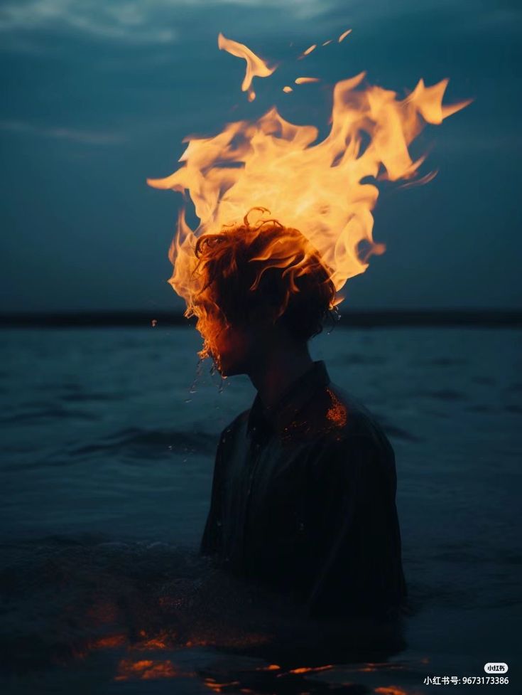 a man standing in the water with fire coming out of his head