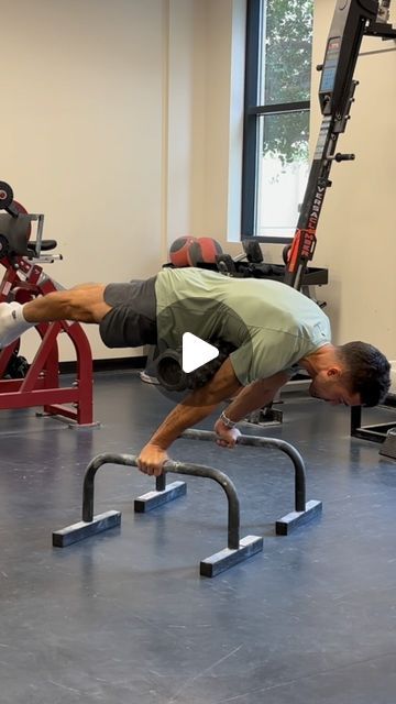 a man doing push ups in a gym