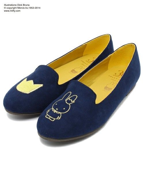 a pair of blue slippers with an elephant on them