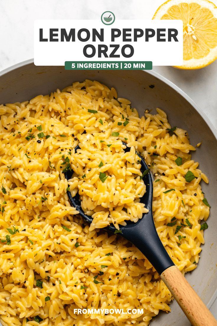 lemon pepper orzo in a skillet with a wooden spoon on the side next to it