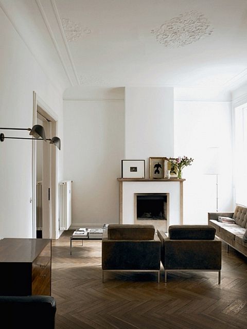 a living room filled with furniture and a fire place