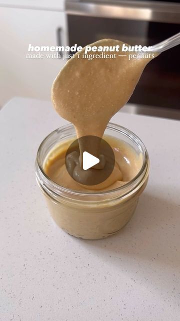 a spoon with some peanut butter in it