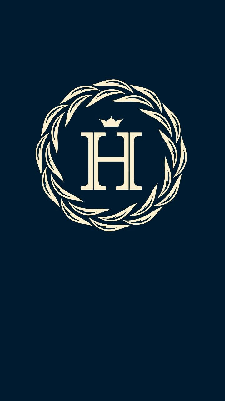 the h logo on a dark blue background with white letters and an oval frame in the center