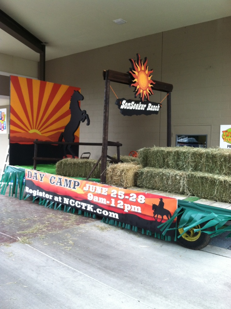 hay bales are stacked on the back of a truck