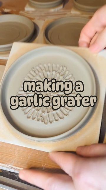 someone is making a ceramic plate with the words making a garlicfater on it