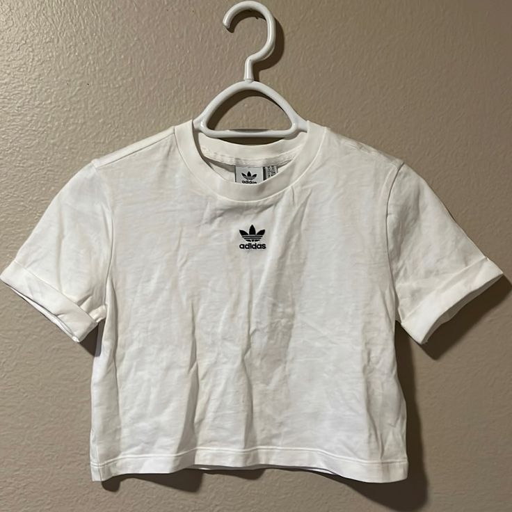 Brand New With Tags, Never Worn. Rolled Up Sleeve Design. Bundle With Any Of My Other Adidas Listings For A Custom Discount Basic Adidas Tops For Streetwear, Basic White Adidas Tops, White Basic Adidas Tops, Adidas White Fitted T-shirt, White Cropped Top For Streetwear, White Adidas T-shirt For Spring, Adidas White T-shirt For Spring, Adidas Spring Streetwear Tops, Adidas White Short Sleeve Tops