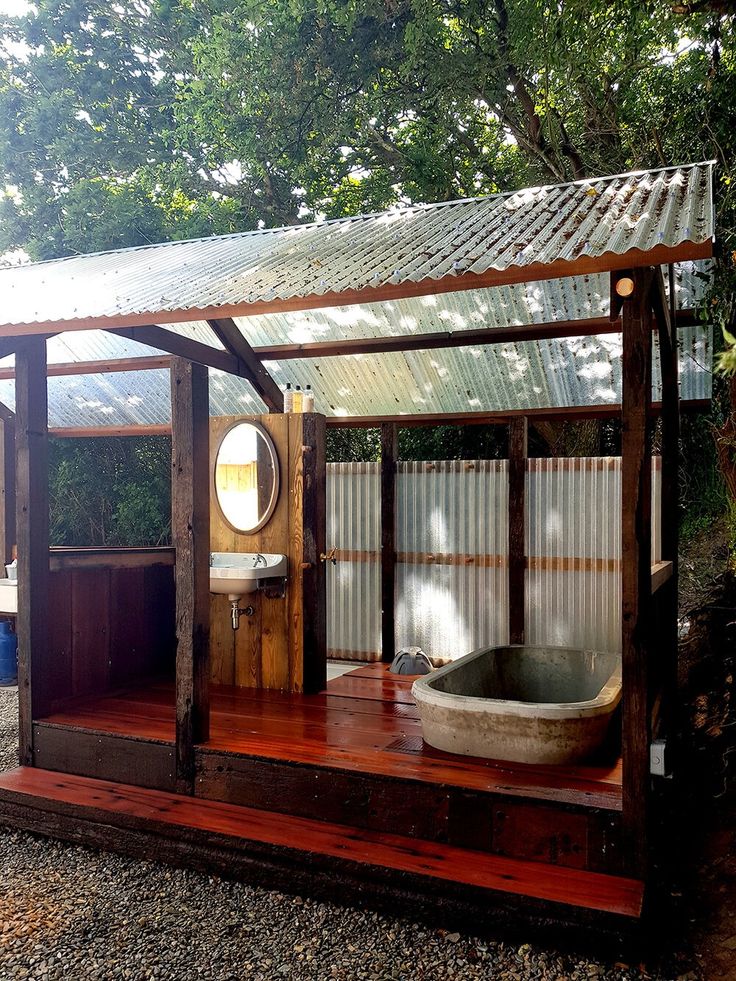 an outdoor spa with a wooden deck and hot tub