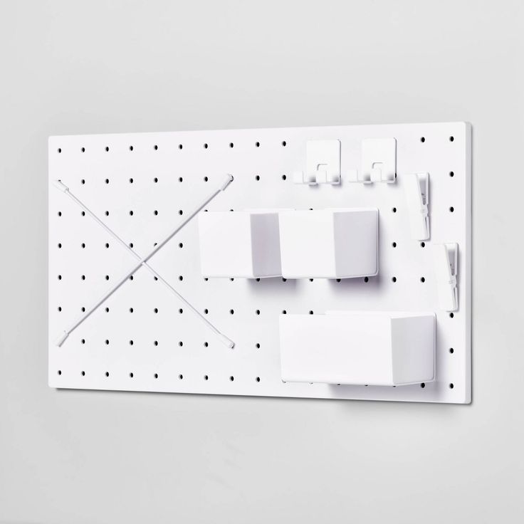 a white wall mounted with three different electrical devices