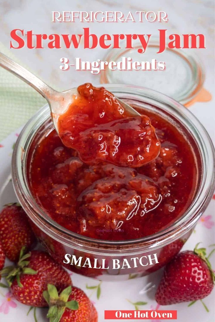 there is a spoon full of jam and strawberries