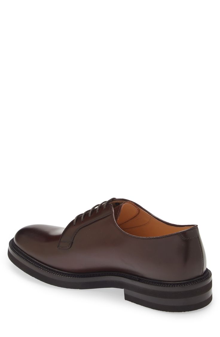 A polished derby is crafted in Italy from smooth and supple calfskin leather and given a traction boost with a textured rubber sole. Leather upper and lining/rubber sole Made in Italy Designer Shoes Derby Oxfords With Branded Insole And Calf Leather, Calf Leather Oxfords With Branded Insole For Derby, Calf Leather Oxfords With Rubber Sole For Derby, Brown Goodyear Welted Derby Shoes For Office, Classic Calf Leather Oxfords With Round Toe, Classic Calf Leather Oxfords With Plain Toe, Cap Toe Derby With Leather Sole And Calf Leather, Classic Oxford Derby Shoes, Calf Leather Derby Shoes With Rubber Sole For Work