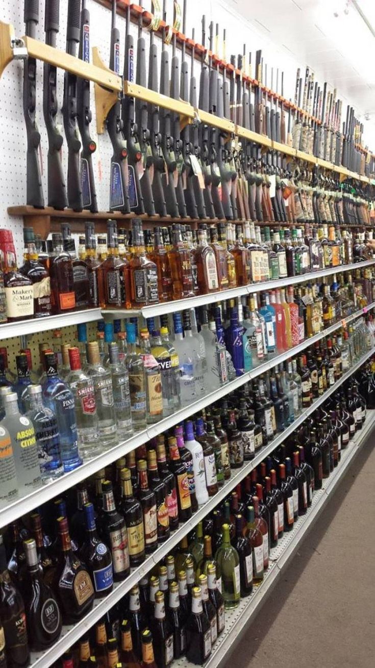 many bottles are lined up on the shelves in a liquor store, and there is no image here to provide a caption for