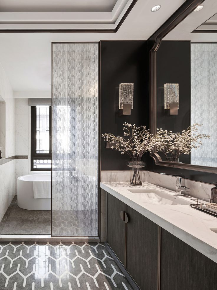 a modern bathroom with black and white decor