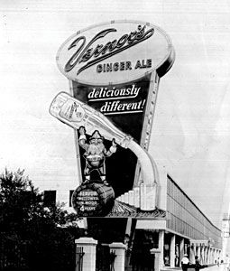 an old black and white photo of a sign for a deliciously different store