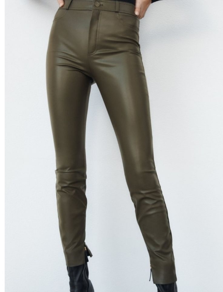 High Waisted Leggings With Back Patch Pockets, Front Zip And Metal Button Closure, Zipper At Hem Waist 17" Inseam 29" Color: Dark Khaki Solid Color High-waisted Faux Leather Pants, High-waisted Faux Leather Pants, Solid High-waisted Faux Leather Pants, Solid Faux Leather High-waisted Pants, Chic High Rise Faux Leather Bottoms, Spring High Rise Faux Leather Bottoms, High Waist Green Leather Pants For Fall, High Rise Faux Leather Bottoms For Spring, High-waist Green Leather Pants For Fall