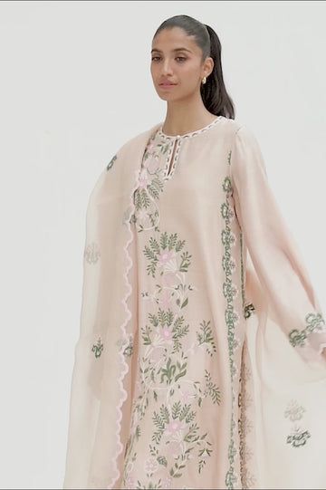 This timeless long shirt silhouette is cut from khaddi silk and is rendered with our signature floral embroidery. An organza dupatta with worked borders and rawsilk trousers complement the look. Spring Floral Embroidery Raw Silk Palazzo Set, Spring Tissue Silk Kurta With Resham Embroidery, Spring Kurta With Chikankari Embroidery In Tissue Silk, Spring Resham Embroidery Tissue Silk Kurta, Spring Chikankari Embroidery Tissue Silk Kurta, Designer Spring Kurta With Sheer Dupatta, Spring Designer Tissue Silk Kurta, Designer Tissue Silk Kurta For Spring, Designer Kurta With Sheer Dupatta For Spring