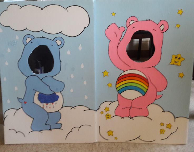 two children's storage bins painted with cartoon bears and rainbows on them