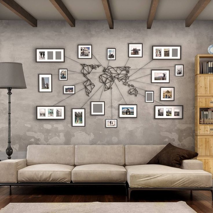 a living room filled with furniture and pictures on the wall next to a book shelf