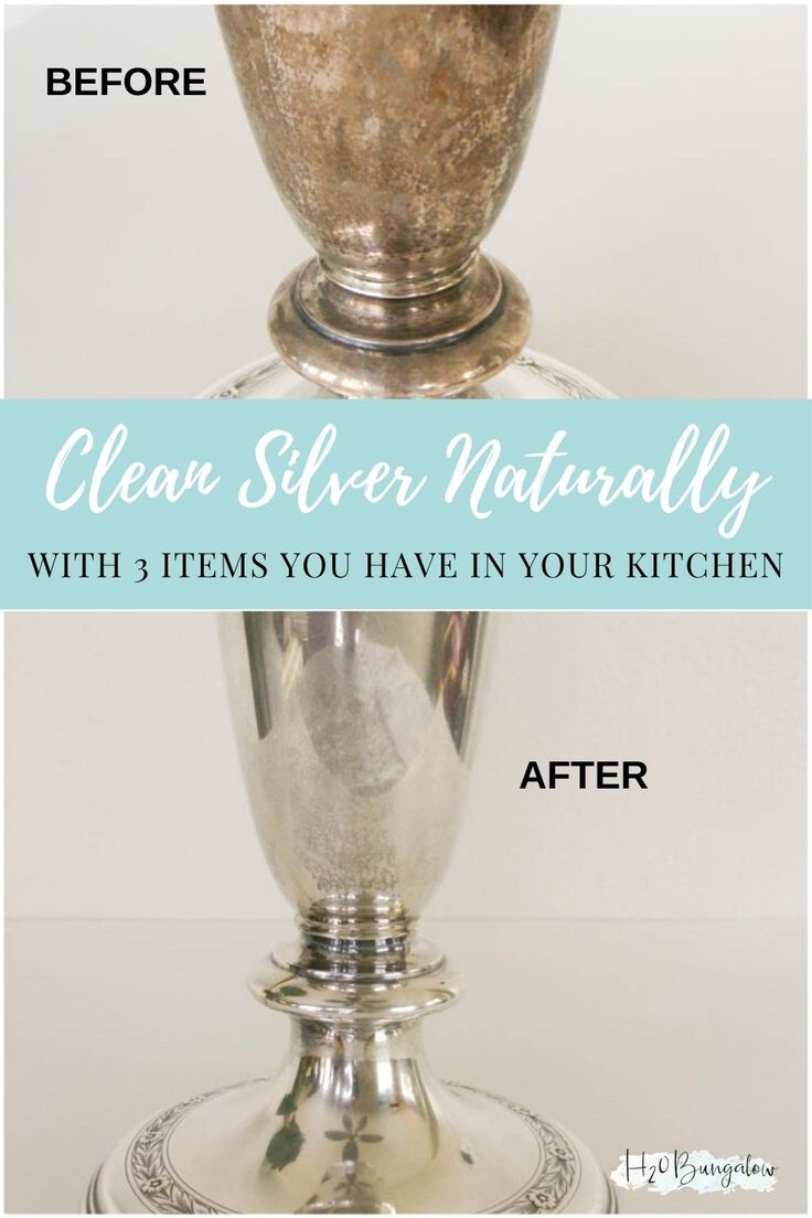 a silver vase sitting on top of a table next to a white wall with the words clean silver naturally