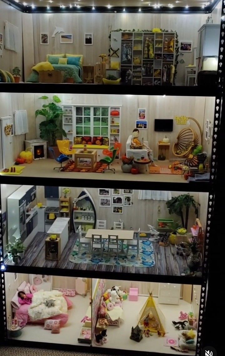 a doll house with all the furniture and accessories in it's display case,