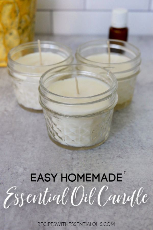 three candles sitting on top of a counter with the words easy homemade essential oil candle