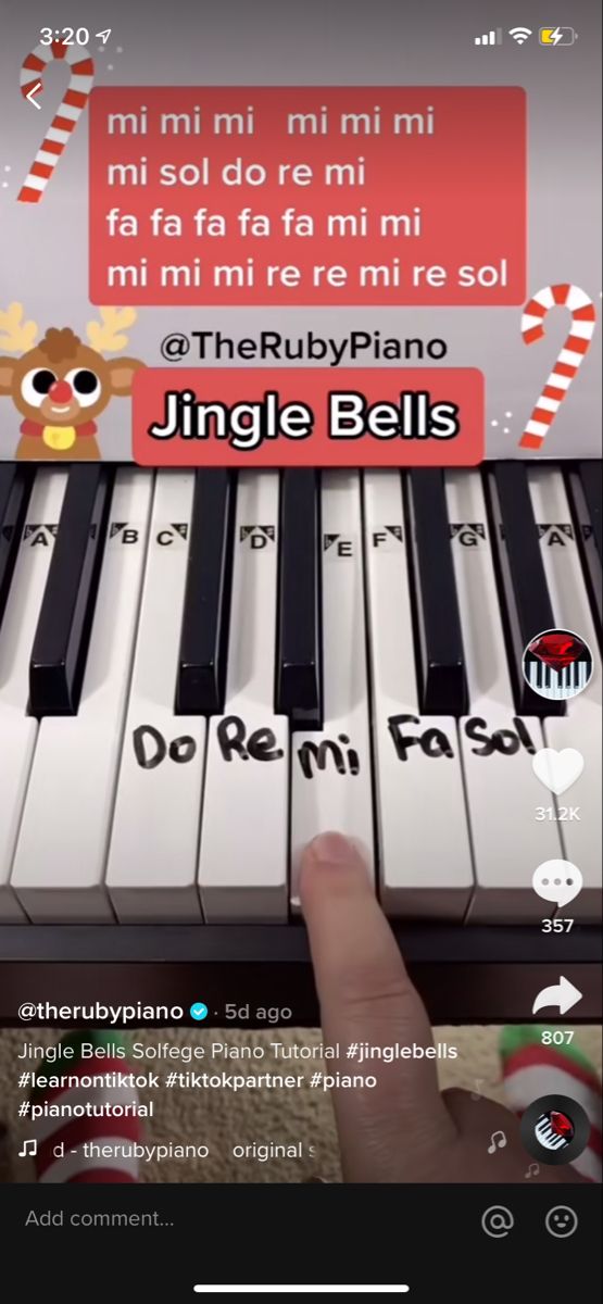 someone is playing the piano on their cell phone, and it looks like they are singing